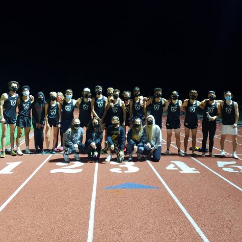 The 2020 cross-country team comes together to share in a photo. Even though the teams meets have thrown a wrench in their season that's not stopping them from becoming a close team.