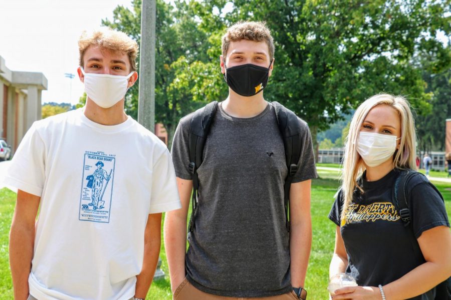 Three+West+Liberty+University+students+demonstrate+proper+mask+etiquette+in+preparation+for+the+shift+to+phase+three.+This+change+allows+for+in-person+activities+to+resume+on+campus.