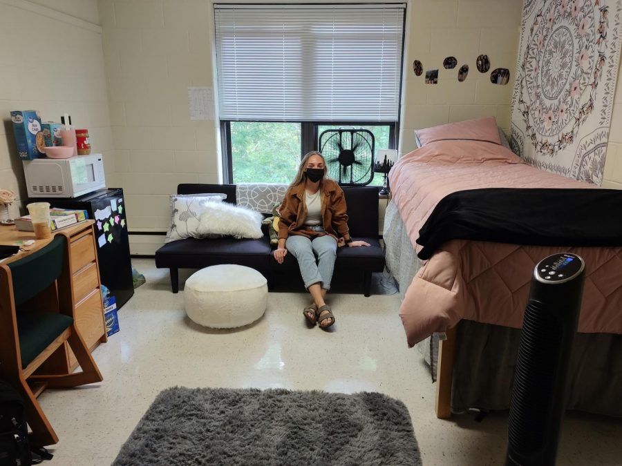 Mikayla Ging relaxing in her dorm room.