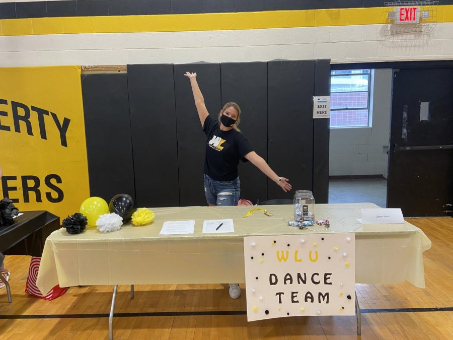 Brooke Anderson promoting the new dance team at the Club and Organization Fair.