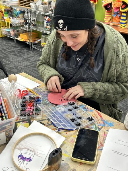 Haley McClain installing safety eyes on her worry pet