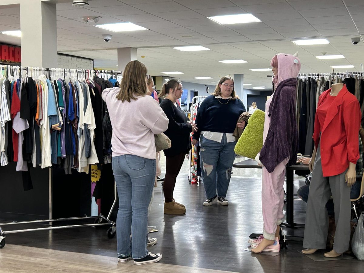 Students shopping at the Topper Thrift racks after the event