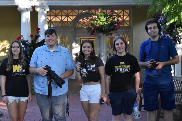 Photo Club posed in font of building at Oglebay Park