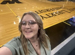 Kaden Bednarek poses in front of the sidelines at the WLU Basketball Court.